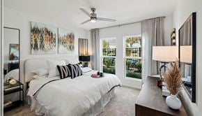 Orlando apartment for rent - a bedroom with a large bed and a ceiling fan at Altis Grand Lake Willis, Orlando Florida