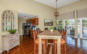 Bradenton apartment for rent - a dining room with a table and chairs and a kitchen