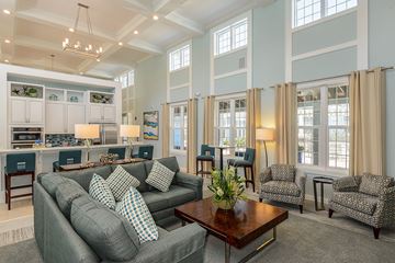 Bradenton apartment for rent - A living room with a grey couch and a coffee table.