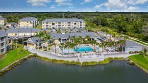 Bradenton apartment for rent - A resort with a pool and a lake.