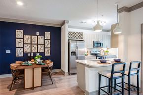 Sarasota apartment for rent - A kitchen with a dining table and chairs.
