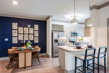 Sarasota apartment for rent - A kitchen with a dining table and chairs.