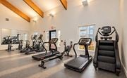 Rogers apartment for rent - A gym with treadmills, elliptical machines, and exercise bikes.