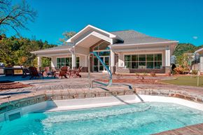 Cullowhee apartment for rent - A house with a pool in front of it.