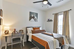 Cullowhee apartment for rent - A bedroom with a bed, desk, and chair.