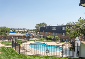 Colorado Springs apartment for rent - A black fence surrounds a small pool.
