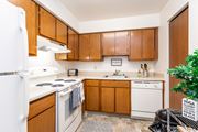 Kalamazoo apartment for rent - A kitchen with wooden cabinets and white appliances at Winchell Way Apartment , Kalamazoo, 49008
