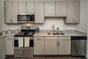 Atlanta apartment for rent - a kitchen with stainless steel appliances and granite counter tops