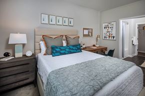 Atlanta apartment for rent - a bedroom with a bed and a desk