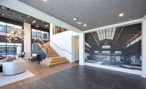 Chamblee apartment for rent - A large open space with a staircase and a large window.