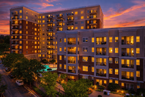 Atlanta apartment for rent - A large apartment complex with a pool in the courtyard.
