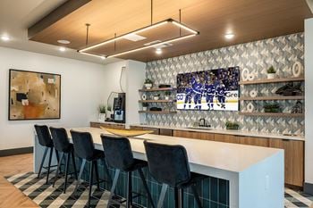 Resident clubhouse w/ coffee bar and private meeting spaces