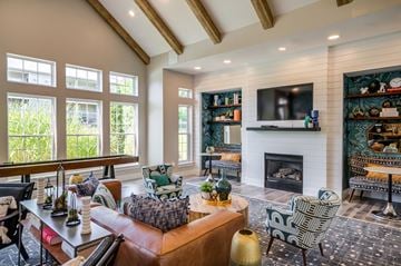 Sterling apartment for rent - A living room with a fireplace and a television on the wall.