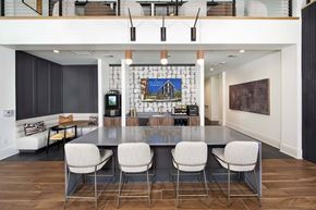 Chamblee apartment for rent - A modern kitchen with a dining table and chairs.