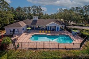 Daytona Beach apartment for rent - A house with a pool in the backyard.
