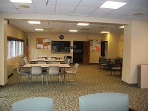 Houghton apartment for rent - a conference room with tables and chairs and a tv