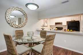 Bradenton apartment for rent - A dining room with a glass table and chairs at Coral Club Apartments in Bradenton, FL
