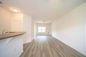 Kennesaw apartment for rent - A room with wooden floors and a window.