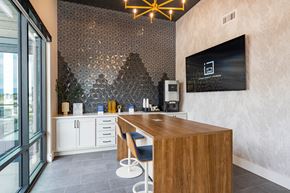 Bozeman apartment for rent - a kitchen with a wooden counter and a tv on the wall