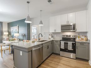 Pooler apartment for rent - A modern kitchen with a stainless steel oven and granite countertops.
