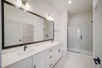 Walk-in tile showers* (in select units)