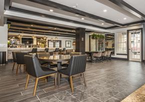 Savannah apartment for rent - A modern dining room with a long table and chairs.