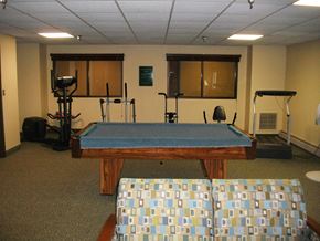 Houghton apartment for rent - a pool table with a blue cloth on top of it