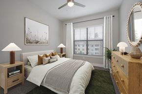 Atlanta apartment for rent - a bedroom with a large window and a ceiling fan