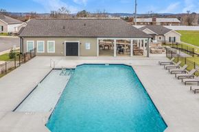 Chattanooga apartment for rent - a swimming pool with a house in the background