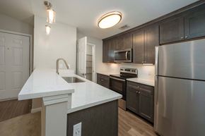 Columbus apartment for rent - A kitchen with a white countertop and stainless steel appliances.