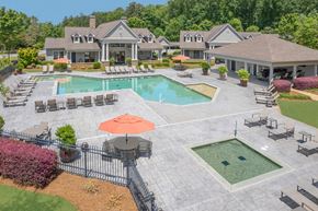 Cumming apartment for rent - A large house with a pool and a patio area.