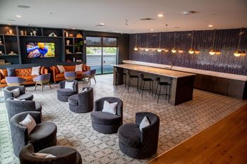 Executive-style resident clubroom with tvs lounges and entertaining kitchen (hamilton exclusive)
