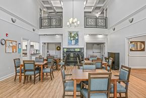 Kennesaw apartment for rent - a large dining room with tables and chairs and a fireplace