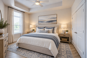 Huntersville apartment for rent - A bedroom with a large bed and a painting on the wall.
