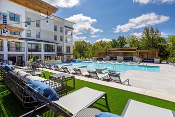 Resort-style saltwater pool with infiniti ledge waterfall, in pool sunlounges, sun deck and private cabanas