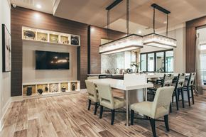 Murfreesboro apartment for rent - a dining room with a table and chairs and a tv