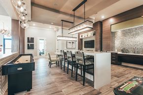 Murfreesboro apartment for rent - a kitchen with a long bar and a dining table
