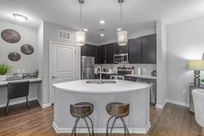 Mount Pleasant apartment for rent - A kitchen with a white island and dark wood floors.
