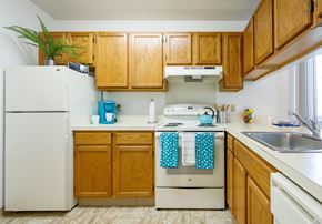 Saginaw triplex for rent - a kitchen with Bar area to see into the Living room