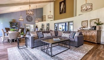 A living room with couches and chairs and a table