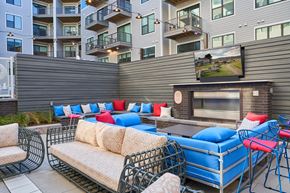 Knoxville apartment for rent - a lounge area with couches and chairs and a fireplace