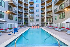 Knoxville apartment for rent - a swimming pool in front of an apartment building