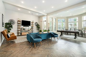 Grand Rapids apartment for rent - A living room with a blue chair in the center.