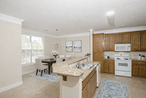 Columbus apartment for rent - A kitchen with a table and chairs in front of a window.