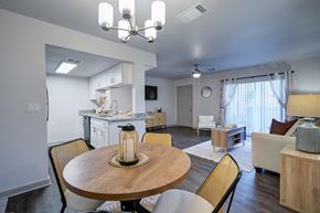 Sarasota apartment for rent - A well-lit dining area with a round wooden table and chairs L'Estancia, Sarasota, FL, 34231
