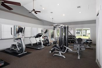 A spacious gym with a variety of exercise equipment