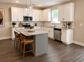 Winder apartment for rent - A Kitchen with island with natural stone countertops and bar top sitting
