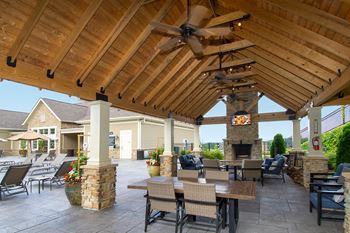 Pool side cabana with tv and wood burning fireplace