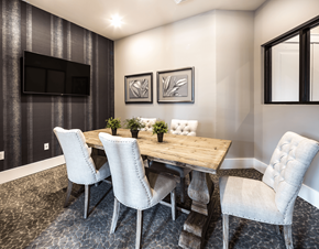 Huntersville apartment for rent - A dining room with a wooden table and white chairs.