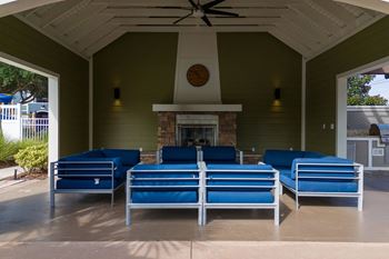 Outdoor fireside lounge with summer kitchen and al fresco dining area